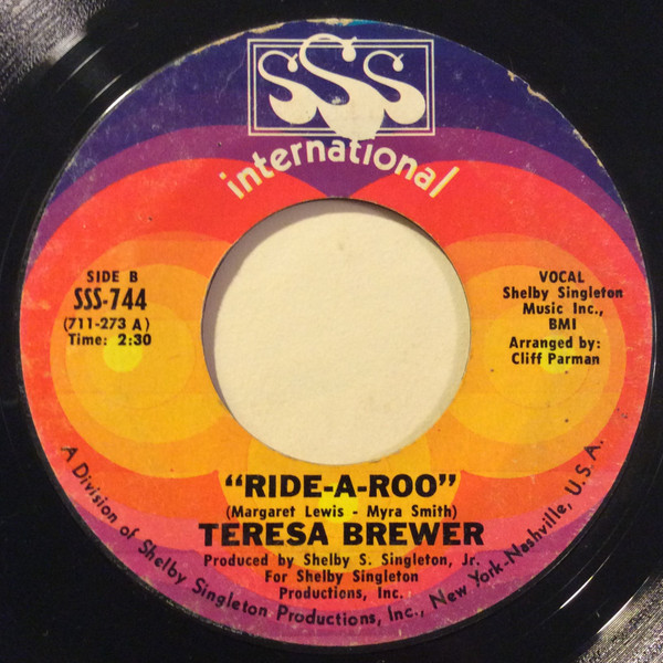Teresa Brewer - A Woman's World / Ride-A-Roo (7") (Very Good Plus (VG+)) - Image 2