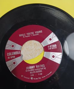 Alternative view of Johnny Mathis - While You're Young (7", Single) (Near Mint (NM or M-))