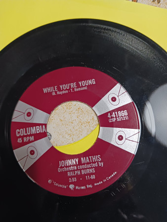 Johnny Mathis - While You're Young (7", Single) (Near Mint (NM or M-)) - Image 2