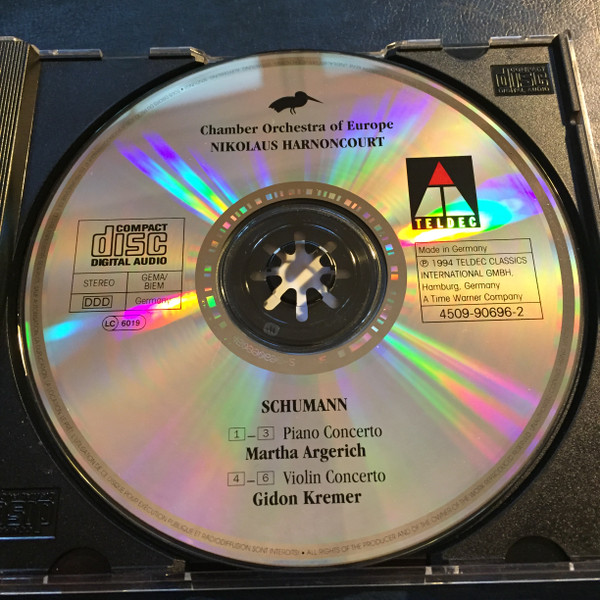 Robert Schumann, Martha Argerich, Gidon Kremer, Nikolaus Harnoncourt, The Chamber Orchestra Of Europe - Piano Concerto / Violin Concerto (CD, Album) (Near Mint (NM or M-)) - Image 2
