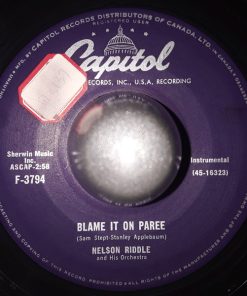 Nelson Riddle And His Orchestra - Blame It On Paree / In A Small Forgotten Town (7", Single) (Very Good (VG))