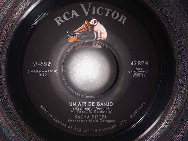 Sacha Distel - Un Air De Banjo/Ou Ca, Ou Ca (7") (Very Good Plus (VG+))