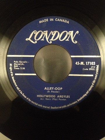 Hollywood Argyles - Alley-Oop (7", Single) (Near Mint (NM or M-))